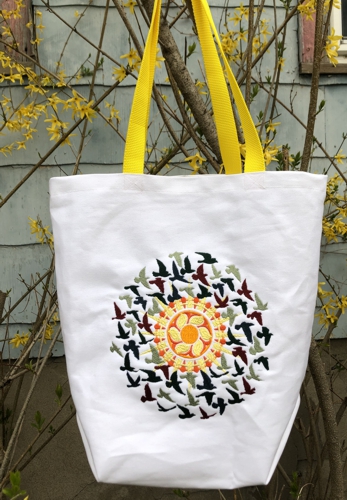 The finished tote with embroidery on the front panel.