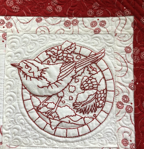 Close-up of the quilting and embroidery.