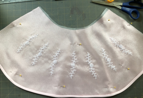 Pin organza overlay to the skirt.