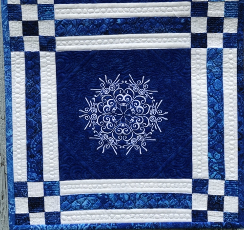 Close-up of the quilting and embroidery.