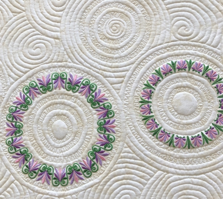 Close-up of the quilting and embroidery patterns.