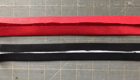 Red and black strips with folded long edges.