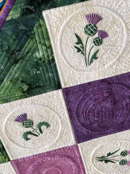 Close-up of the embroidery and quilting patterns.