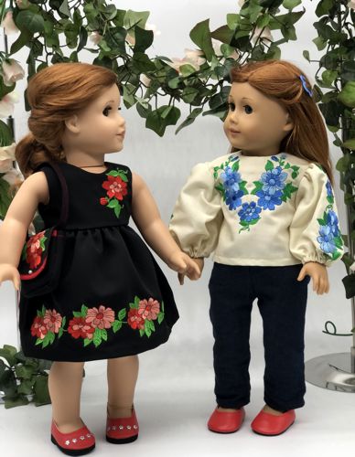 2 dolls in finished outfits with embroidery on bodice, sleeves and skirt.