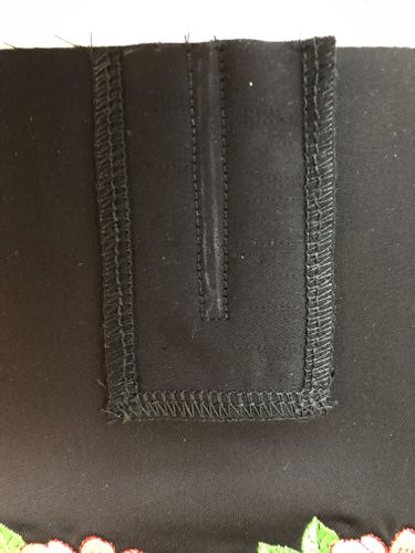 Stitch the plank to the center of the back panel.