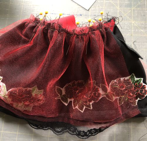 Pin the underskirt ,with right side down, to the bodice