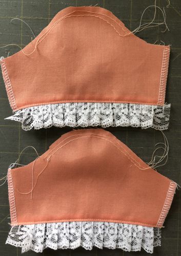 Sew 2 rows of gathering stitches on the sleeve cap.