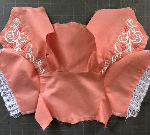 Bothe sleeves attached to the bodice.