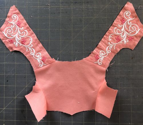 Photo of the bodice with front and back stitched at shoulders.