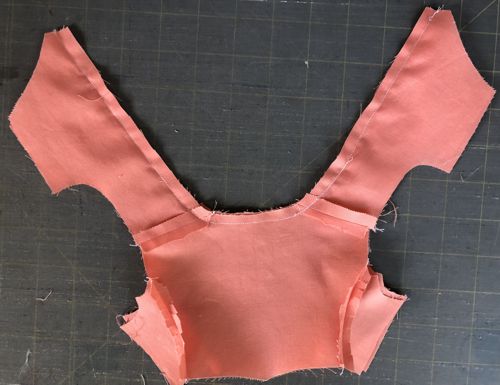 Photo demonstrating how to sew the bodice and bodice lining together