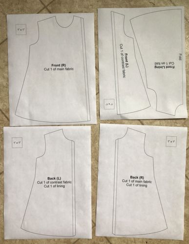 4 sheets of paper with print-outs of the dress template.