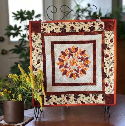 FInished quilt on a stand
