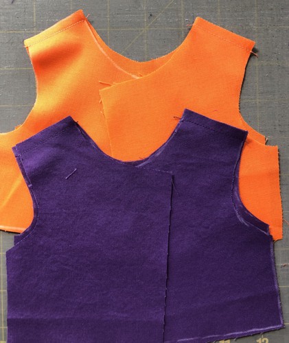 the top and its lining stitched at shoulders.