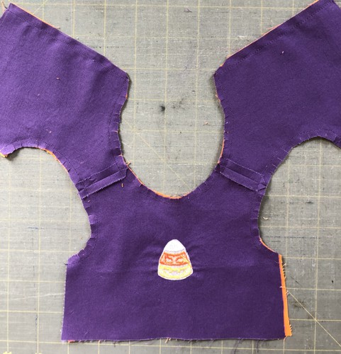 Stitch along the neckline, back and armholes.