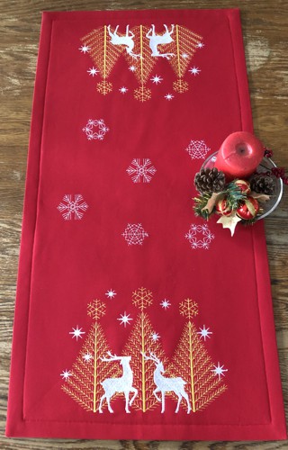 Finished red colored tablerunner with deer and snowflake embroidery