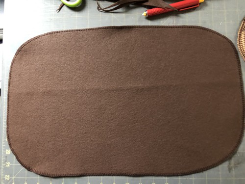 Brown piece with finished edges.