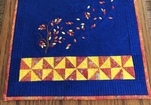 Close-up of the blocks and embroidery.