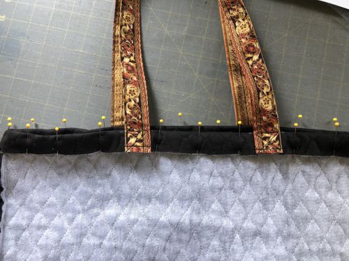 Stitching the upper edge of the bag