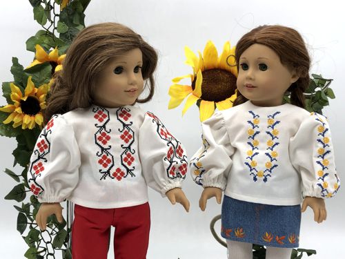 Two dolls in the finished blouses.