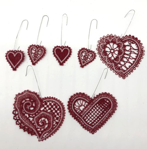 Stitchouts of the lace hearts with wire hooks
