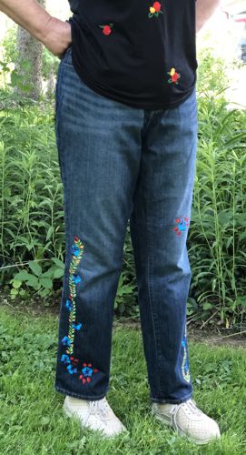 Jeans embroidered with the designs of morning glory vines and flowers