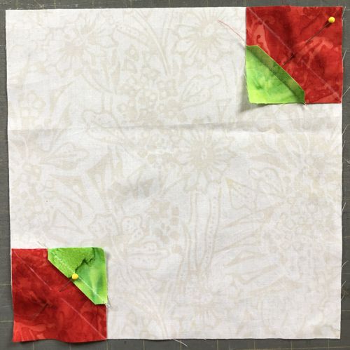 Green-red squares in the opposite corners of the cream square.