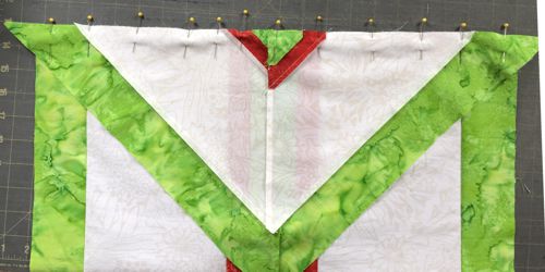 Triangle pinned to the main part of the tablerunner.