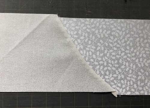 A new strip with curved connection of 2 white fabrics is finished