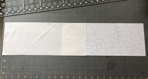 2 strips of white fabrics overlaping at short edges