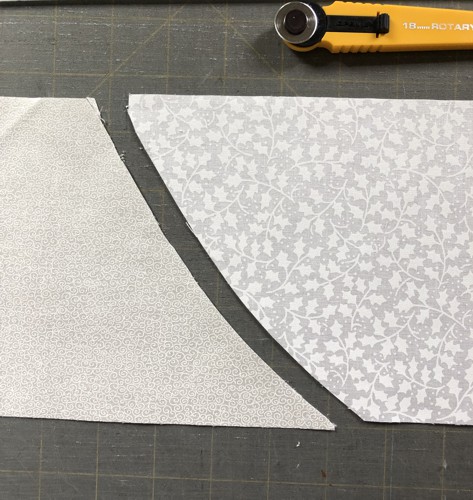 2 strips of white fabrics after overlaping edges cut