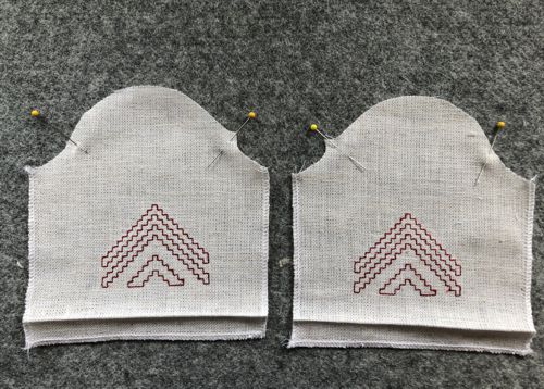 Sleeves with finished edges.