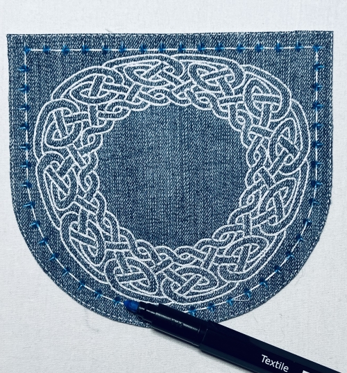 Tracing the outer stitches with the fabric marker.