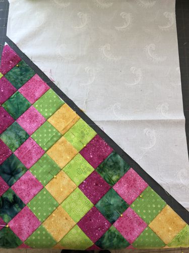 Photo shows how to cut the wholecloth piece for runner's ends.