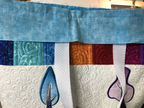 A strip sewn to the upper edge of the tote.