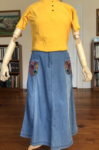 A denim skirt with embroidered pockets