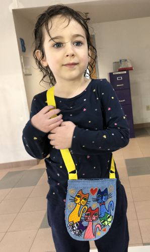 A cross-body purse for a child