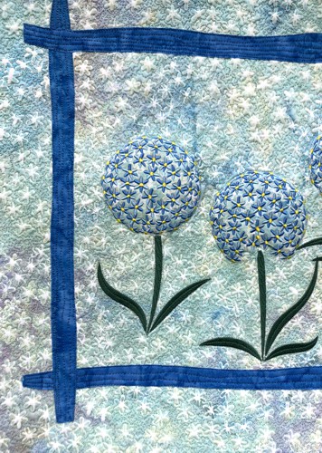 A close-up of the embroidery and quilting stitches