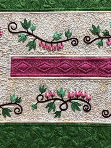 A close-up of the embroidery and quilting stitches.