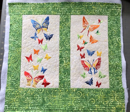 One of the panels quilted in a free-motion style.