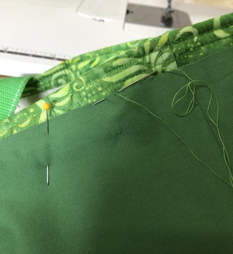 Hand-stitch the lining to the bag.