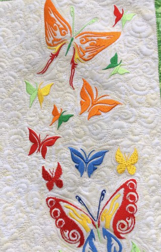 Close-up of the embroidery and quilting pattern.