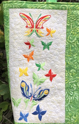 Close-up of the embroidery and quilting pattern.