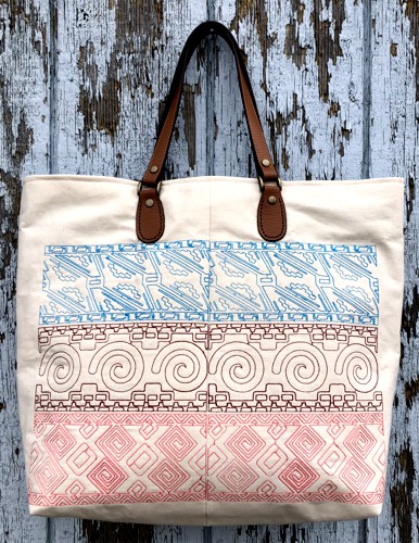 The finished tote bag with Mexican motif embroidery on the front and back panels