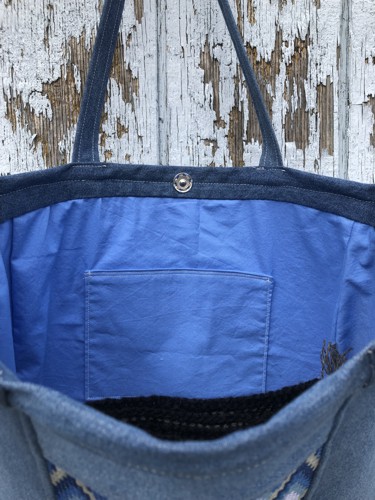 Sew the sew-on snap to the inside of the bag.