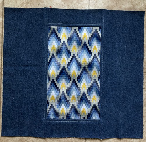 The panel with embroidery stitch-out in center.