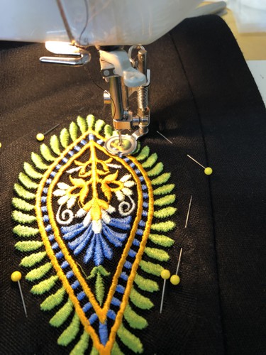 An embroidery stitch-out sewn to the jacket
