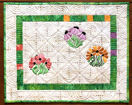 Small wall quilt with flower embroidery