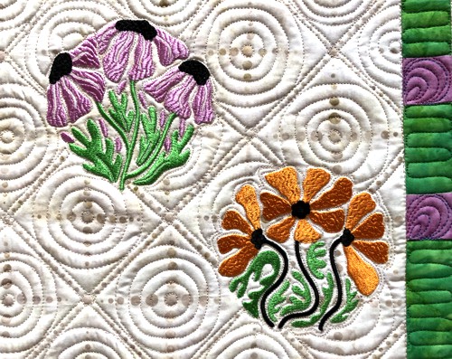 A close-up of the embroidery and quilting stitches