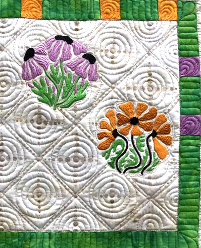 A close-up of the embroidery and quilting stitches