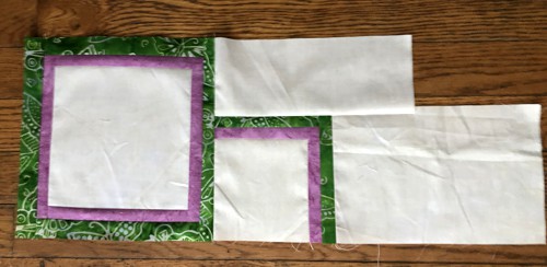 Sew the second type of unit to the right edge of a large block